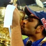Rohit Sharma kisses the IPL trophy