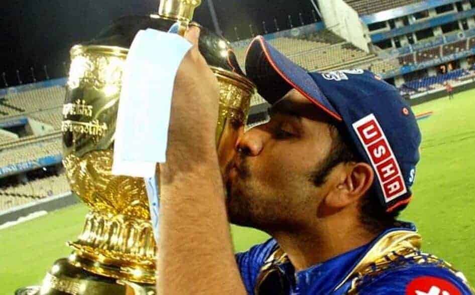 Rohit Sharma kisses the IPL trophy