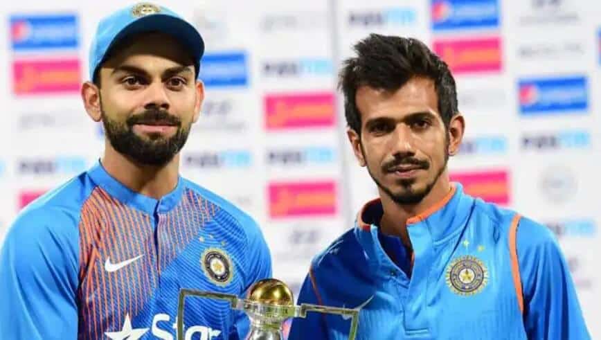 Yuzvendra Chahal standing alongside Kohli. He is a key player according to our India vs England First T20I Betting Tips & Predictions